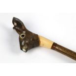 A walking stick with carved wooden handle in the form of a rabbit, length 131 cm.