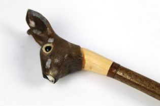 A walking stick with carved wooden handle in the form of a rabbit, length 131 cm.