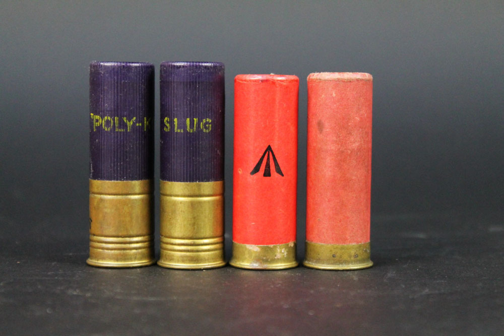 Four 12 bore shotgun cartridges, paper and plastic cases loaded with slugs,