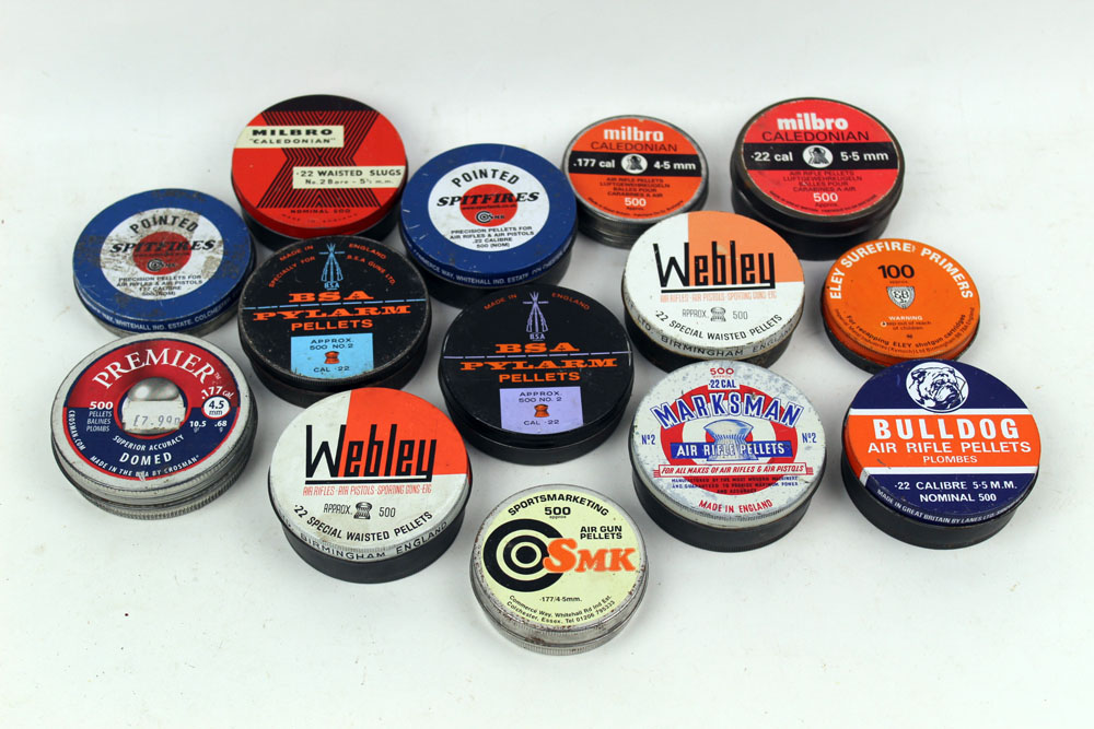 Fourteen vintage air gun pellet tins, some containing pellets, to include BSA, Webley, Bulldog etc.