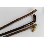 Three wooden shafted walking sticks, largest 148 cm, smallest 116 cm.