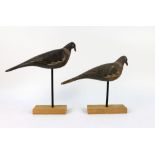 A pair of early 20th century wooden pigeon decoys, in the manner of Francis Rolph of Lakenheath,