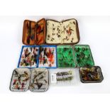 A quantity of salmon and trout flies, in various fly boxes, pouches etc.