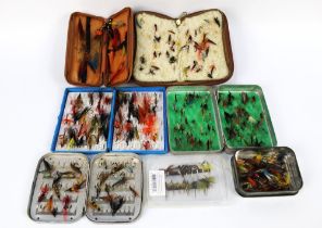 A quantity of salmon and trout flies, in various fly boxes, pouches etc.