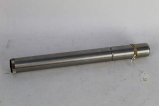 A stainless steel moderator, stamps 243 Win, length +/- 37 cm. FIREARMS CERTIFICATE REQUIRED.