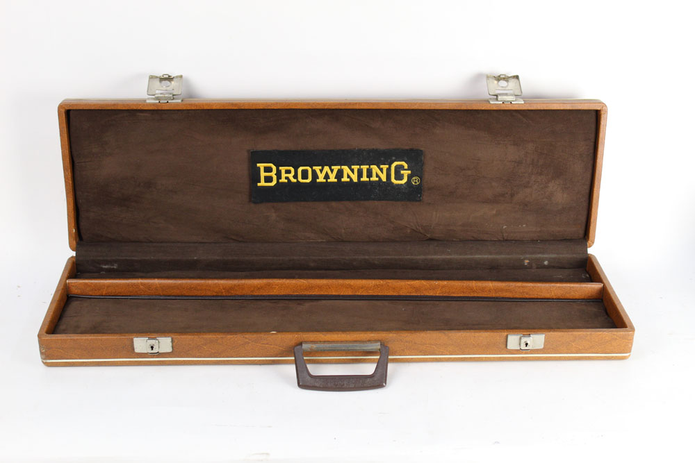 A leatherette shotgun motorcase opening to a brown interior with stitched Browning label to the lid,