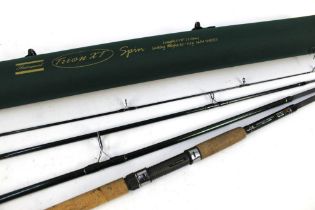 A Shakespeare Trion XT spinning rod, in four sections 11'.