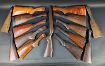 A box containing shotgun stocks, various different styles.