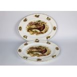 Two bone china ashettes, decorated with game birds. 31 x 41 cm.