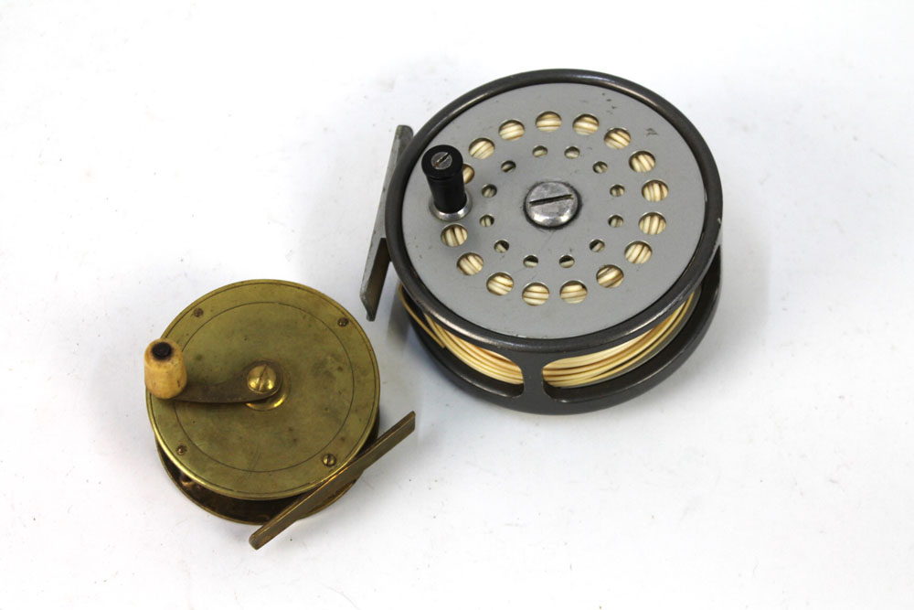 Two reels, Sharpes of Aberdeen The Gordon salmon fly reel 4" and a brass reel with bone handle.