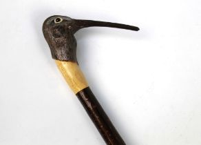 A walking stick with carved wooden handle in the form of a curlew, length 124 cm.