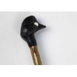 A walking stick with carved wooden handle in the form of a golden eye duck, length 142 cm.