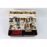 A tackle box containing Nicholson's of Cockermouth spoons, various Abu Koster spoons, Tobys,