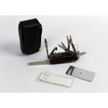 Victorinox Switzerland a Swiss Army knife, having various tools to include knife, pliers, torch,