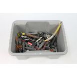 A plastic tub containing a large quantity of sea fishing weights, pirks etc.