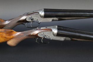 Stephen Grant & Sons London a pair of 12 bore side lever side by side shotguns,