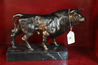 Reproduction cast metal ornament, bull mounted on marble plinth,