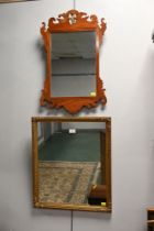 Two mirrors, one wooden fretwork the other gilt coloured,