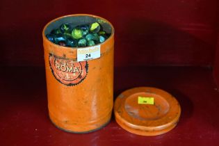 Vintage tin containing marbles