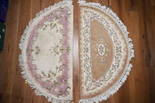 Two semicircular rugs,