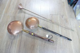 Two copper bed warming pans and coaching horn