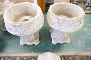 Pair of classical style composite garden urns,