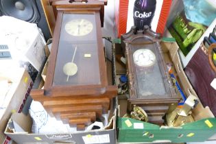 Two boxes of clock parts and two wall clocks