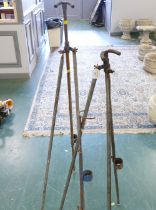 Two metal tripod fishing rod stands/rests