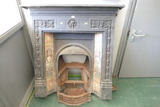 Cast fireplace with Art Nouveau style tile inlay, height 113 cm,