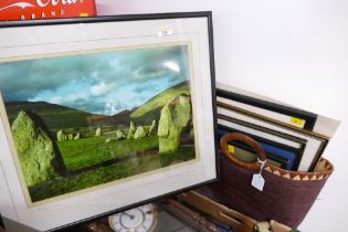 Basket of mixed pictures and photograph frames and mounted and framed print of Castlerigg Stone