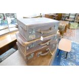 Three vintage leather suitcases, largest 56 cm long, 33 cm wide,