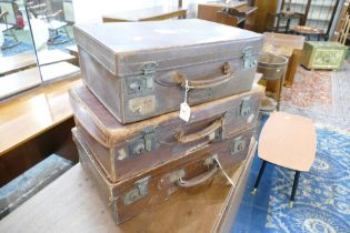 Three vintage leather suitcases, largest 56 cm long, 33 cm wide,