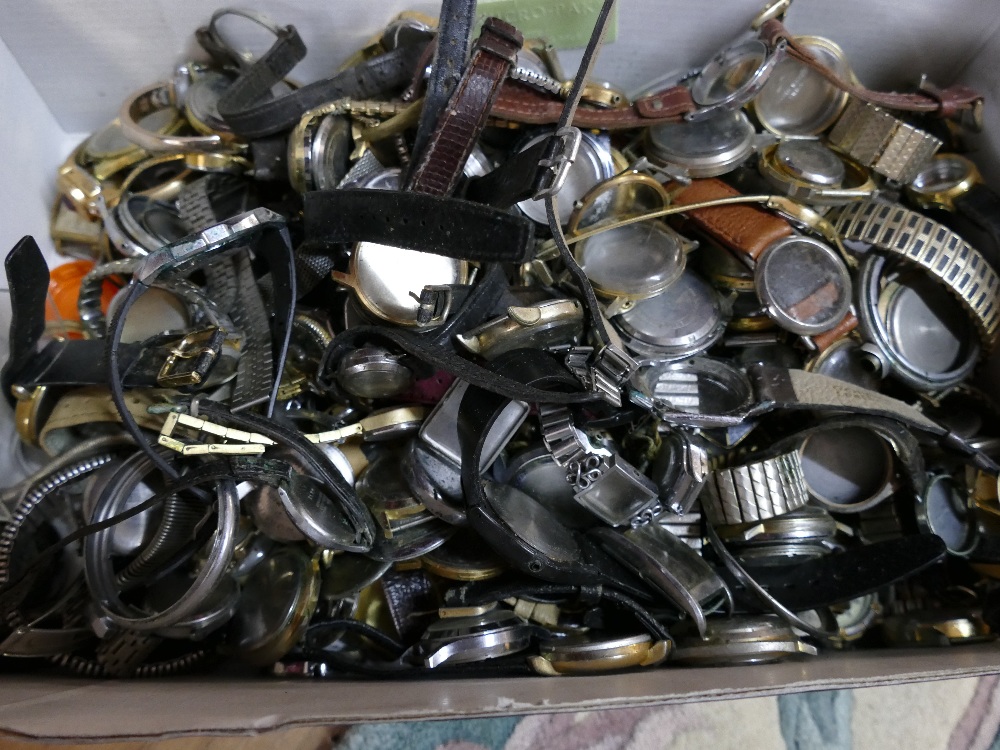 Box of watch parts including straps, backs, cases,