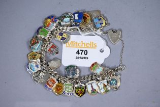 Silver and white metal charm bracelet with enamelled shield charms