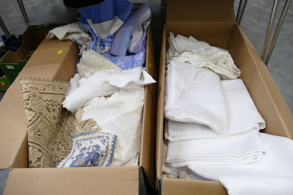 Two boxes of tablecloths and crocheted pieces