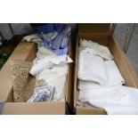 Two boxes of tablecloths and crocheted pieces