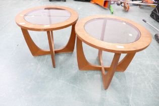 Pair of mid 20th century circular occasional tables with glazed inset tops on curved interlocking