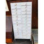 Late 19th century set of graduated drawers containing watch parts and spares, height 67 cm,