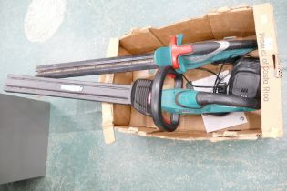 Two Bosch cordless hedge trimmers