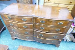 Serpentine fronted reproduction eight flight chest of drawers