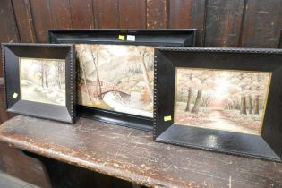 Three needlework scenes in black frames
