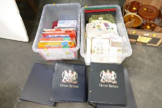Two boxes of stamp books,