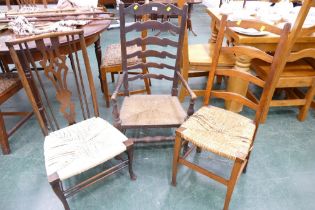 Late 19th century splat back nursing chair raised on cabriole legs and two ladderback chairs