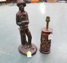 Cowboy figure and carved African lamp base