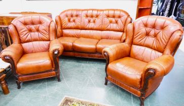 Modern deep buttoned leather three seater settee and two armchairs