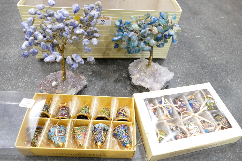 Two decorative mineral trees and two boxes of miniature eggs and bells