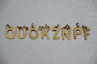 9 ct gold letter pendants, weight 4.