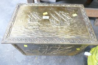 Brass log box and books,