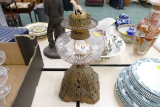 19th century oil lamp with cast metal base,