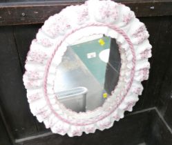 Oval mirror with ceramic frame,